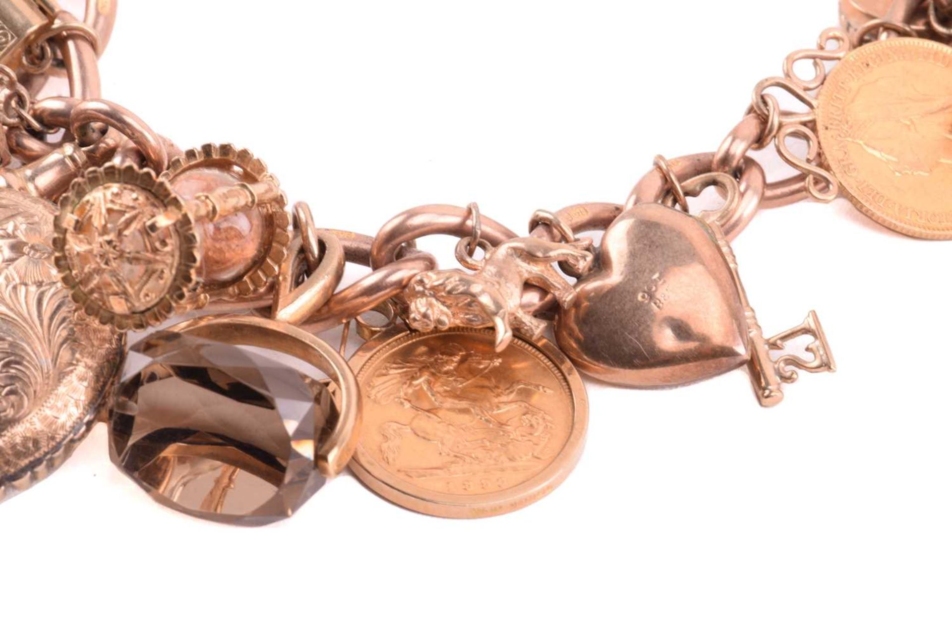 A double Albert chain charm bracelet in 9ct rose gold, constituted of a heavy curb link terminated - Image 2 of 4