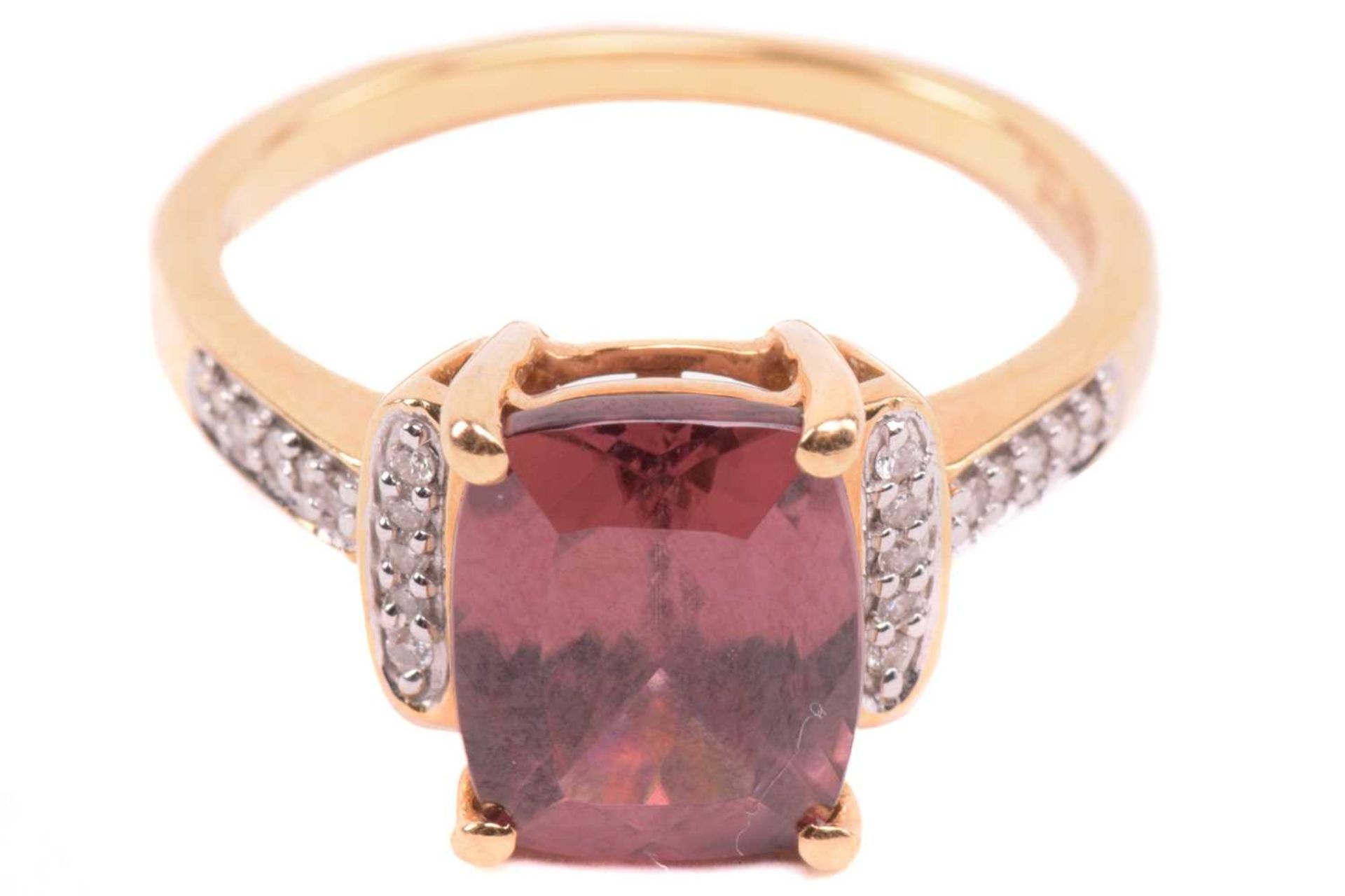 A red zircon and diamond dress ring in 18ct yellow gold, centred with a cushion-cut red zircon in - Image 2 of 5