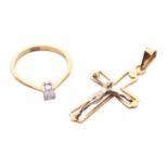 A diamond solitaire ring and a crucifix pendant; the 18ct gold ring centred with an emerald-cut