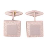 A pair of square cufflinks, the bevelled head centred with a brushed finish panel, framed with a