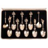 Ten 18th/19th century Dutch figural spoons later gilded in later case, comprising a set of five