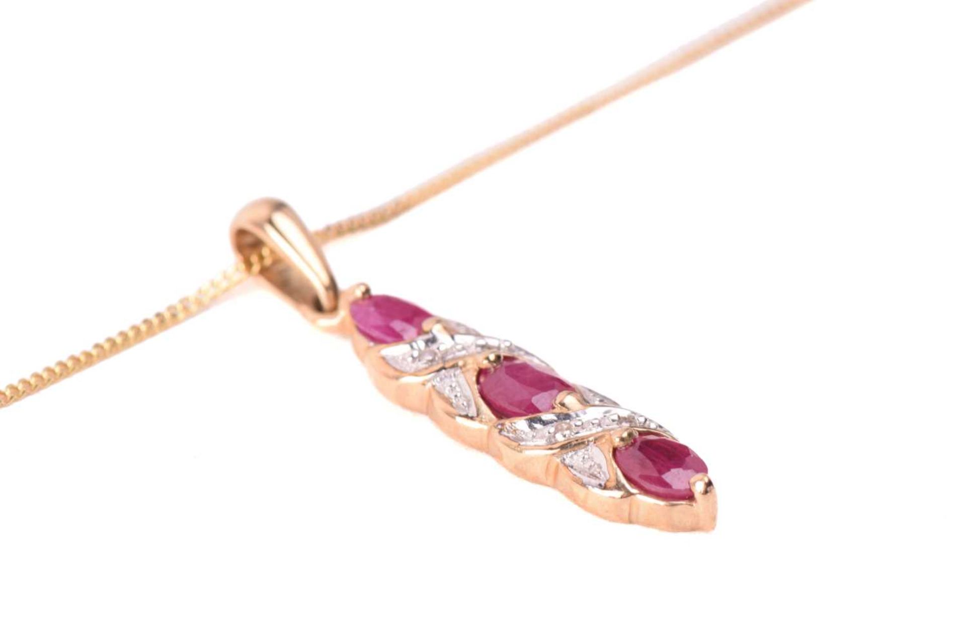 A ruby necklace and earrings ensuite together with a dress ring; the pendant set with three oval-cut - Image 4 of 8