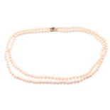 A double-strand cultured pearl necklace, comprising two rows of graduated pearls with cream body