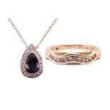 An iolite and diamond drop shape pendant, the central pear shape iolite measuring 7.8mm x 5.6mm,