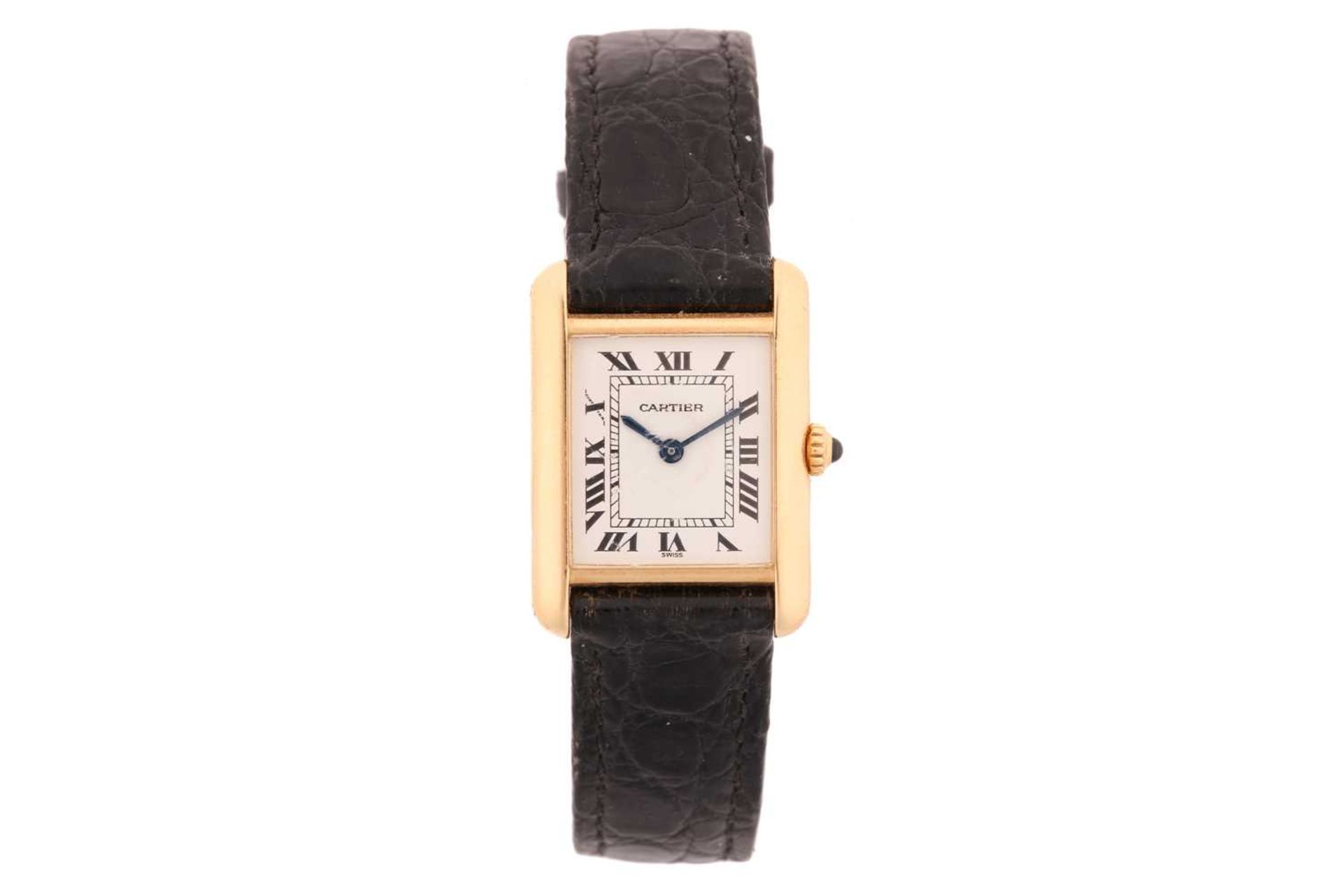 A Cartier Tank 18k gold ladies quartz wristwatch ref. 21003350, the white dial having Roman numerals