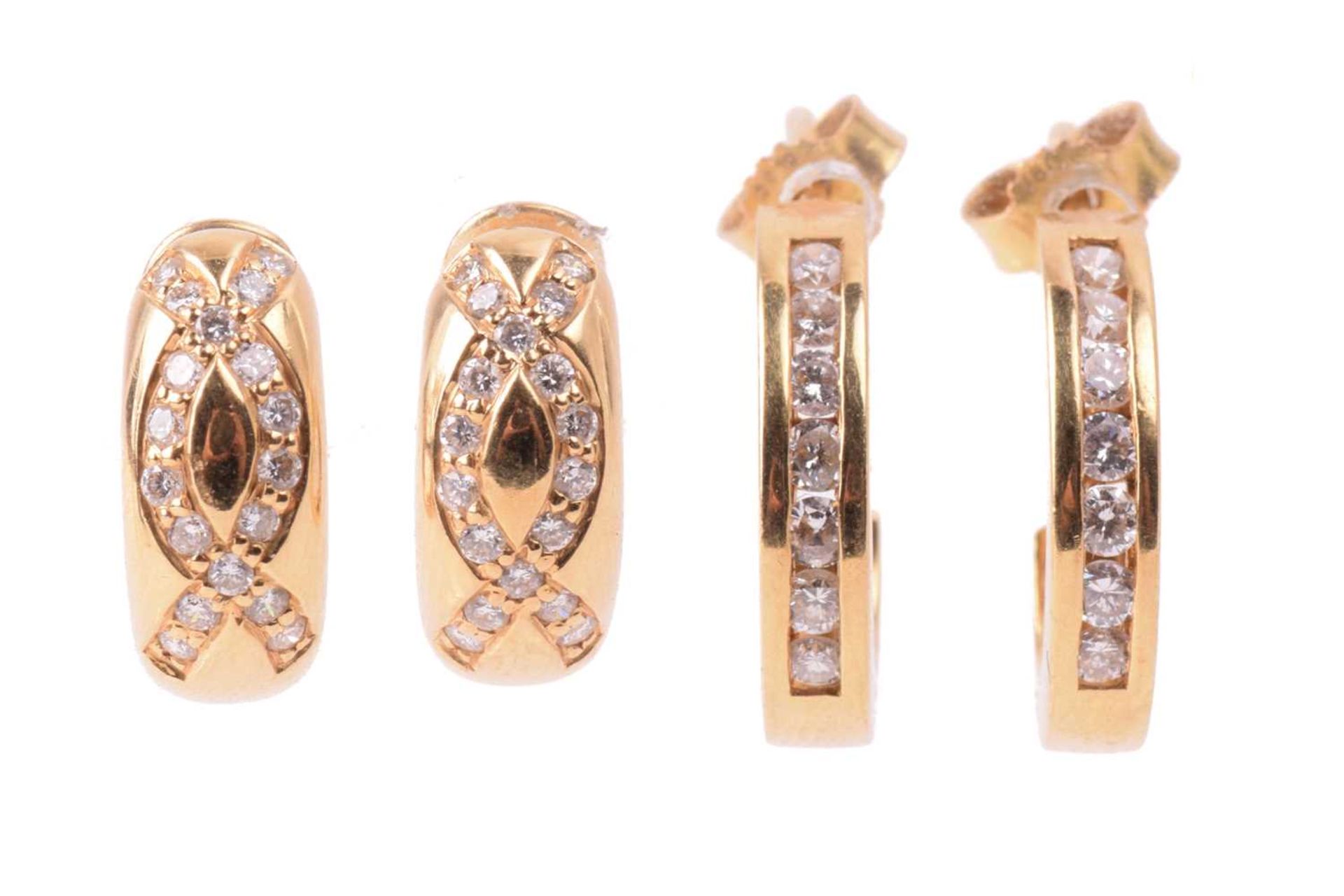 Two pairs of diamond-set hoop earrings in 18ct yellow gold; the first channel-set with diamond