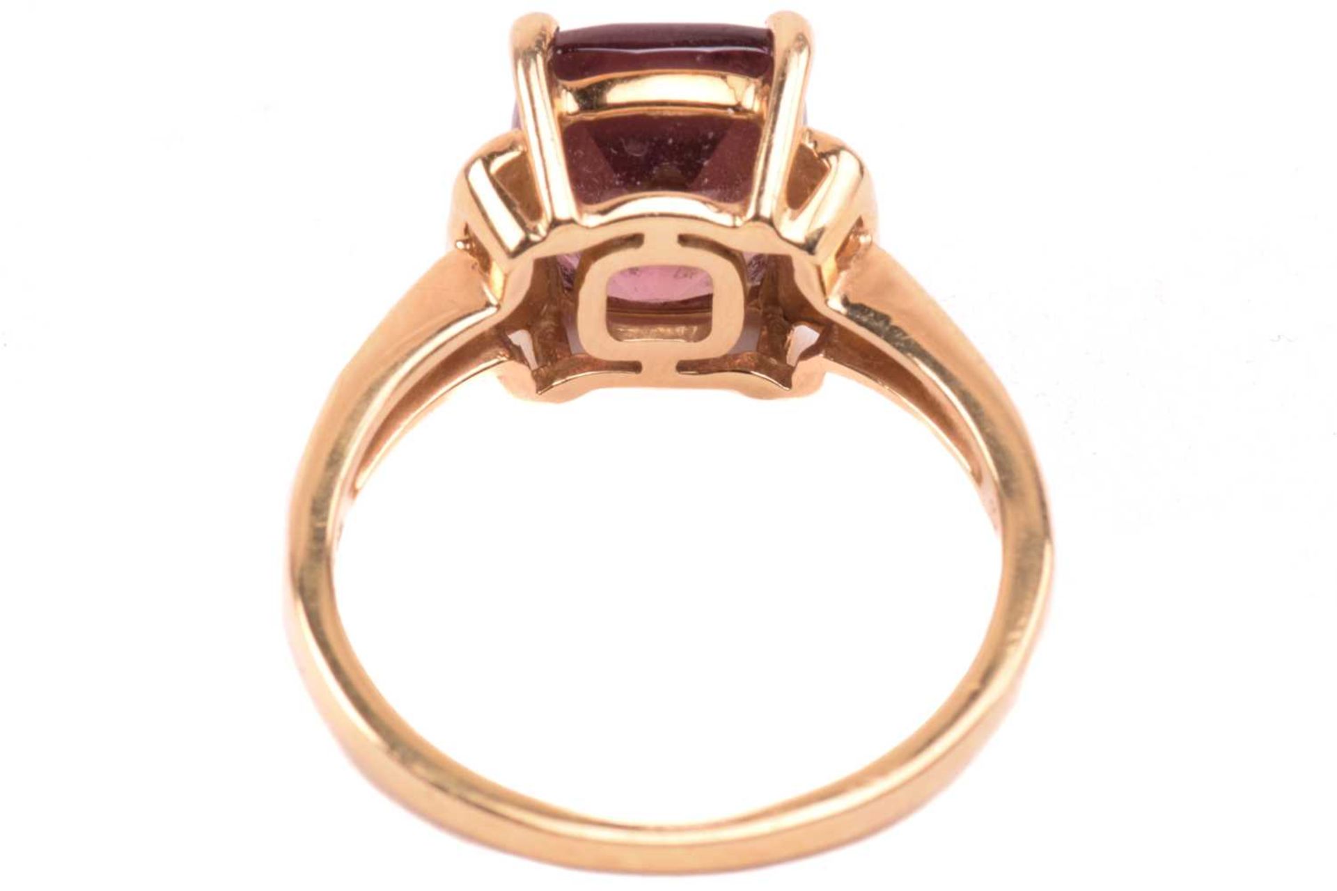 A red zircon and diamond dress ring in 18ct yellow gold, centred with a cushion-cut red zircon in - Image 5 of 5