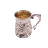 An 18th century silver mug with later Victorian decoration of baluster form with double scroll