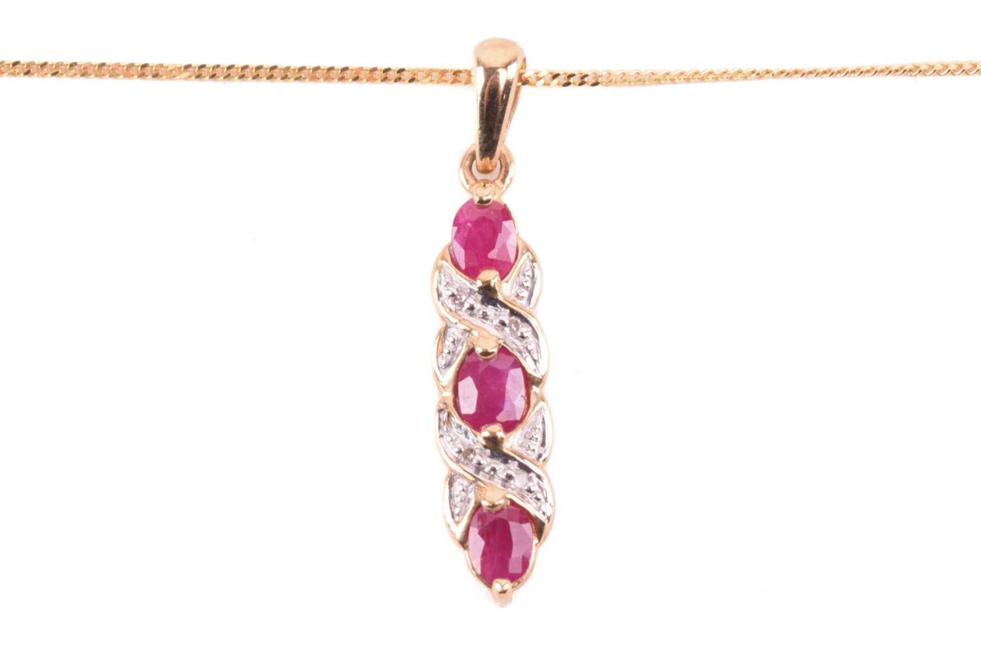 A ruby necklace and earrings ensuite together with a dress ring; the pendant set with three oval-cut - Image 3 of 8