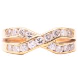 A diamond cross over ring, set with two rows of round brilliant cut diamonds in a channel setting,