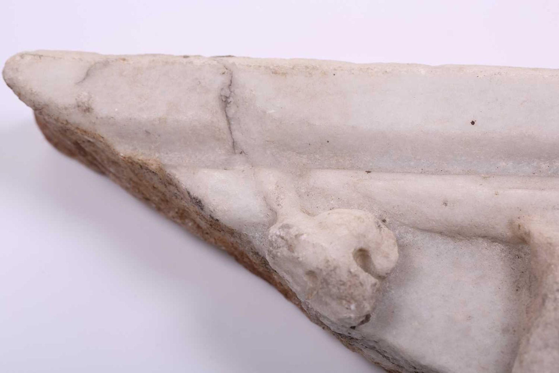 A Roman Marble fragment, 2nd/3rd century AD, possibly part of a sarcophagus, depicitng a youth in - Image 9 of 11