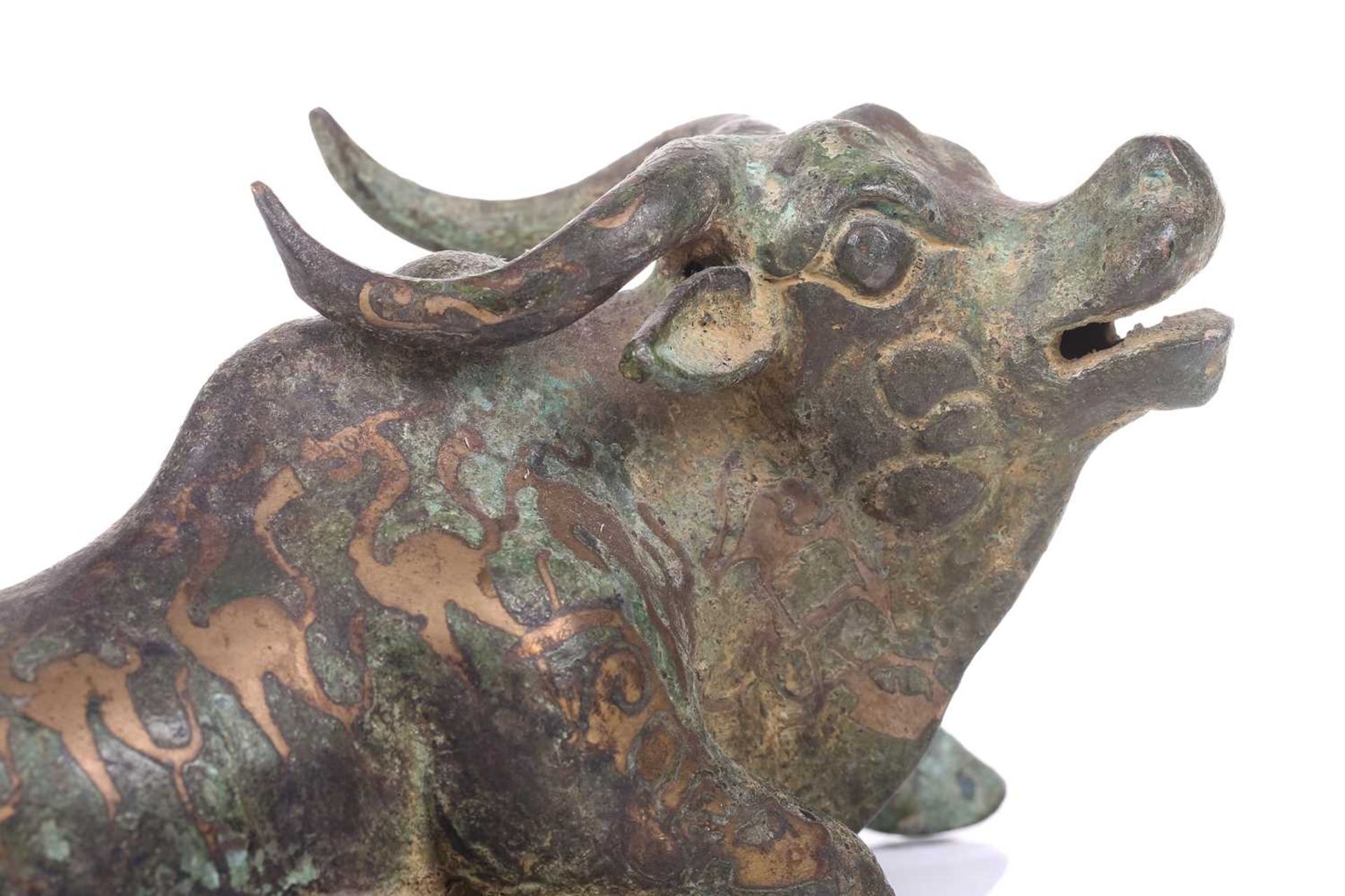 A Chinese bronze and gilt recumbent bull, possibly Zhou dynasty or later, the animal with one leg - Image 7 of 20