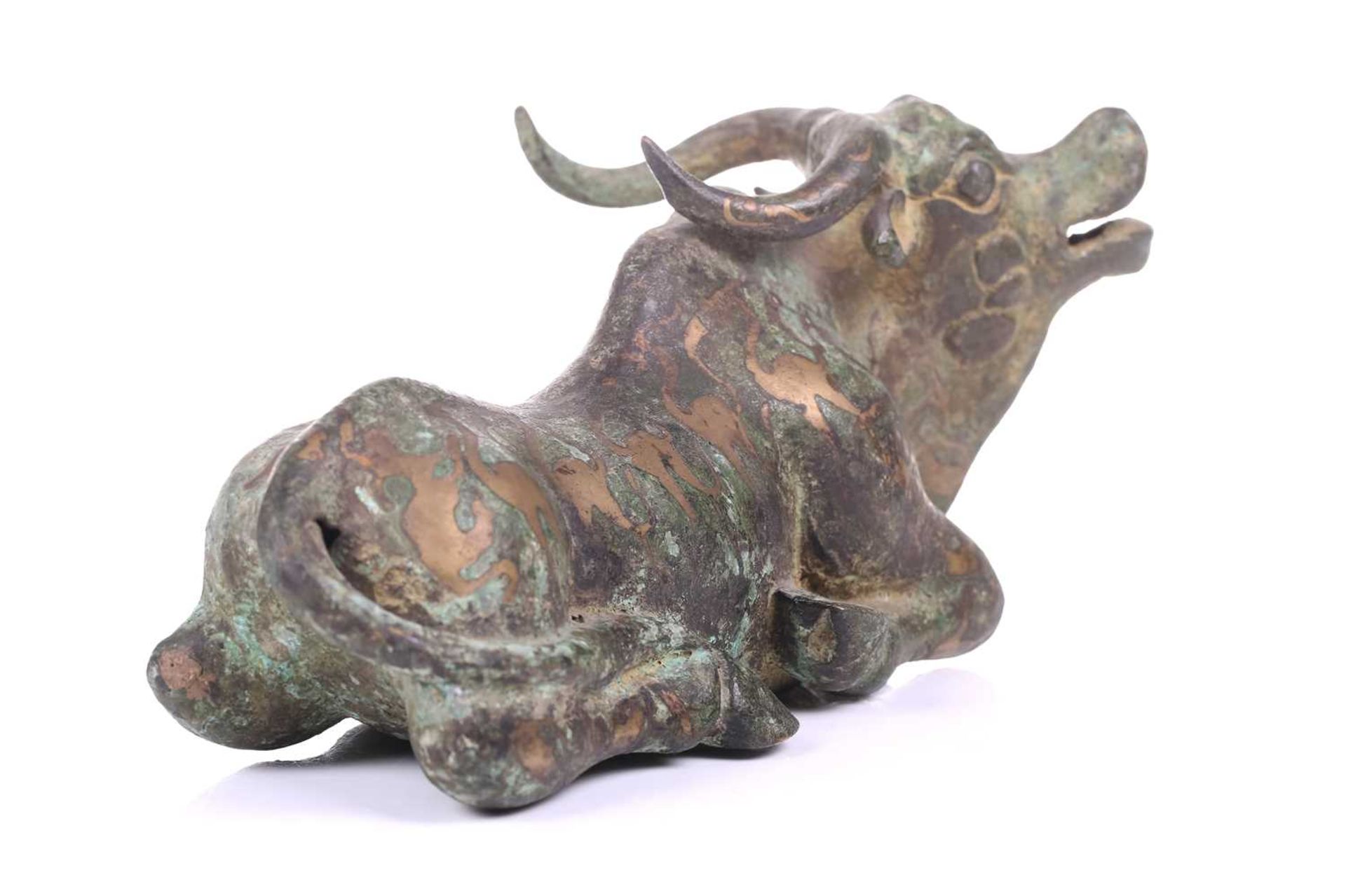 A Chinese bronze and gilt recumbent bull, possibly Zhou dynasty or later, the animal with one leg - Image 2 of 20