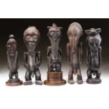 A group of Hemba standing male figures, Democratic Republic of Congo, three with long linear