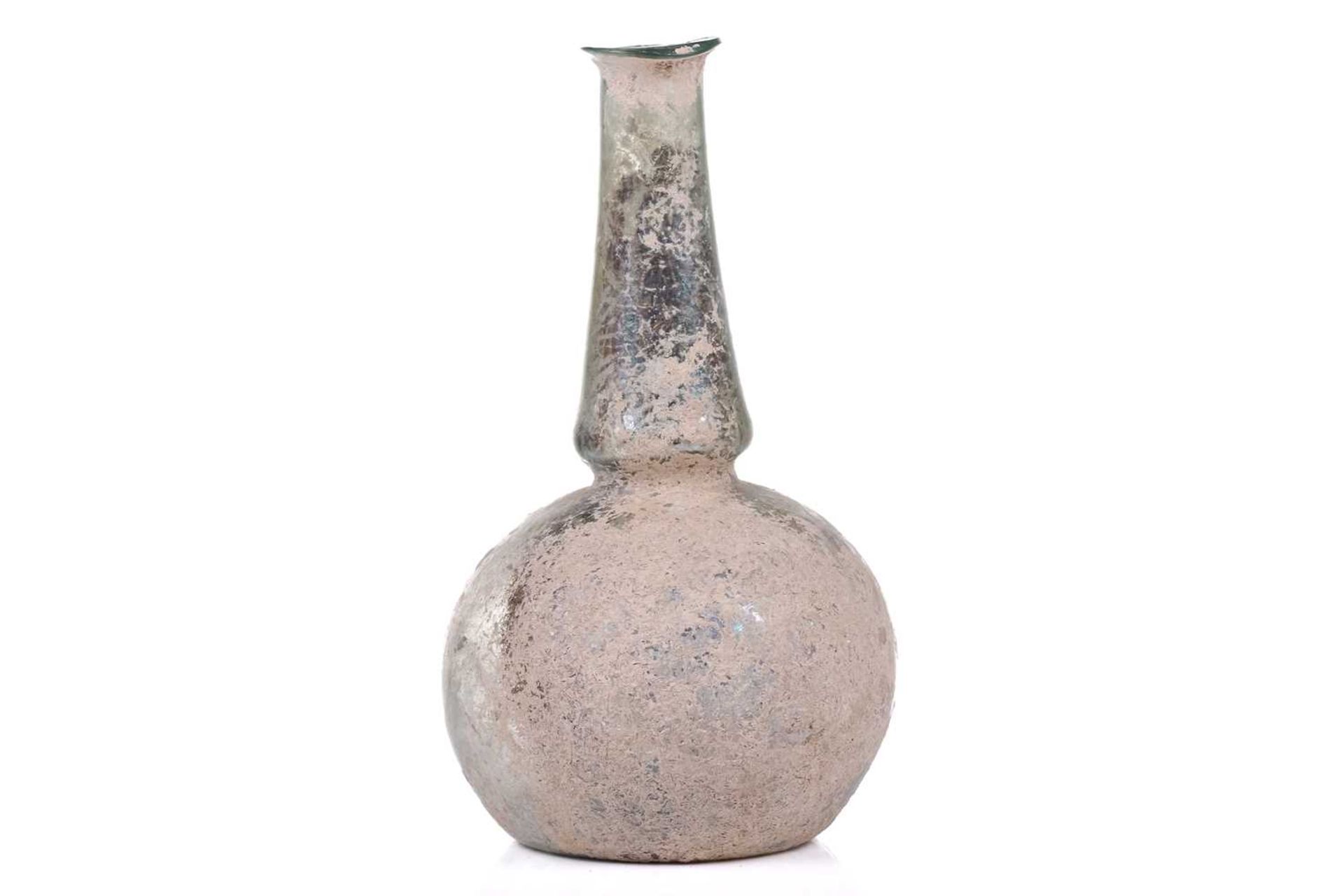 A Roman glass bulbous flask with everted rim, signs of oxidation and encrusted soil to the - Image 6 of 6