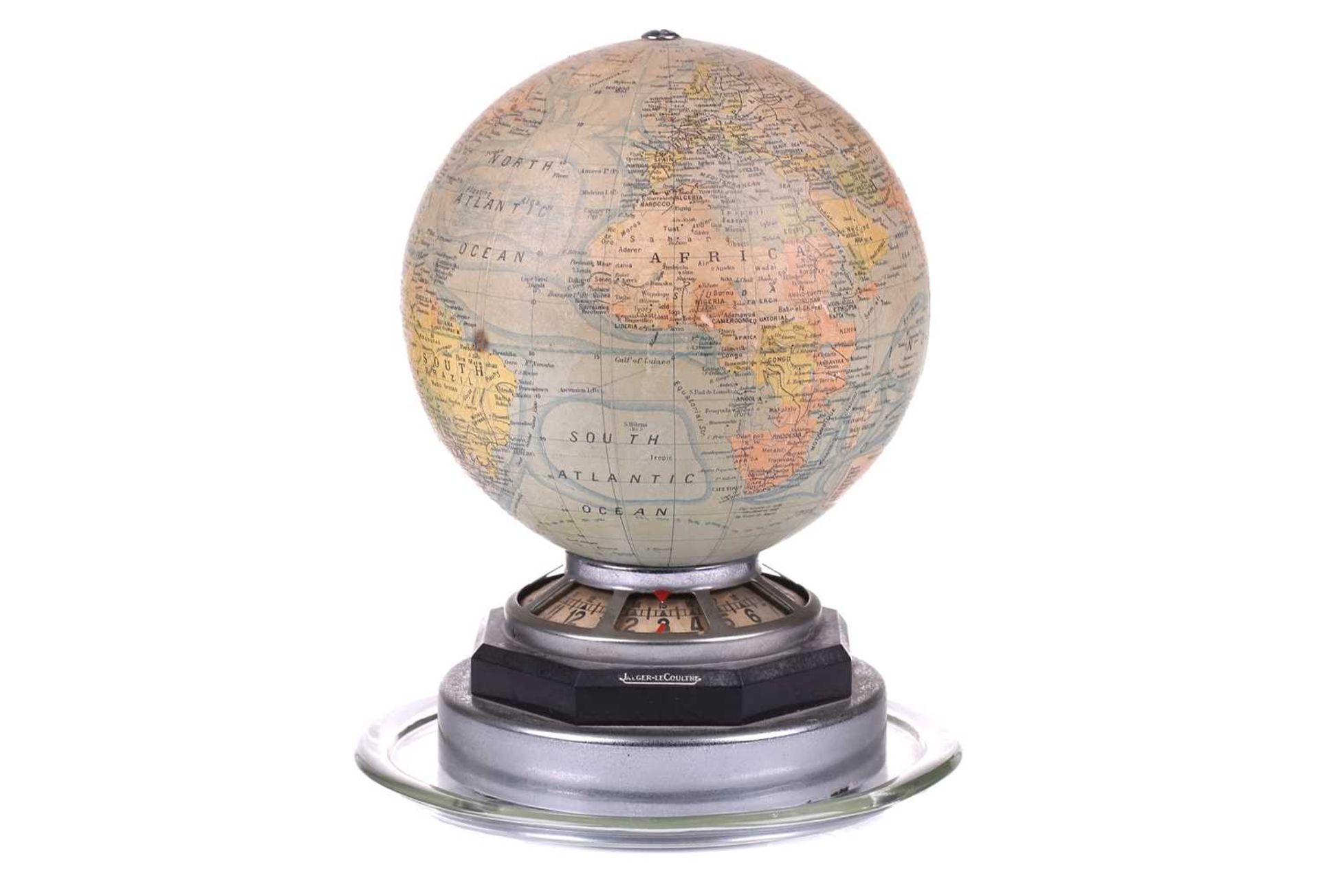 A rare Jaeger-LeCoultre illuminating globe world time desk clock, the terrestrial paper on glass