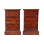 A pair of Victorian mahogany bedside drawers, each with moulded edge top above three graduated