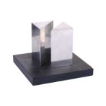 Justin Knowles (1935-2004), 'Forms', chrome shapes on a slate base, 12 cm high x 16 cm square.Chip