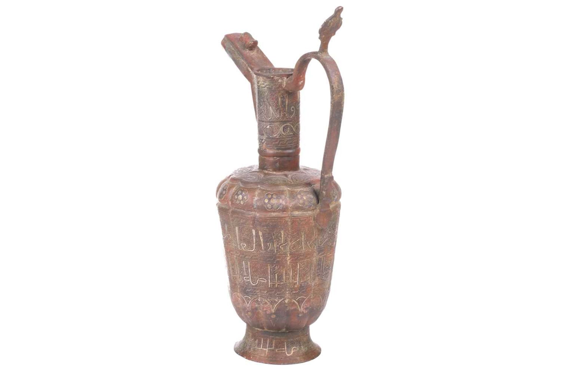 A 'Khorosan' style ewer, probaly North east Iran, of fluted lobed form, with stylised Islamic - Bild 2 aus 11