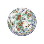 A Cantagalli Pottery charger, depicting exotic birds and butterflies among a flowering tree, painted