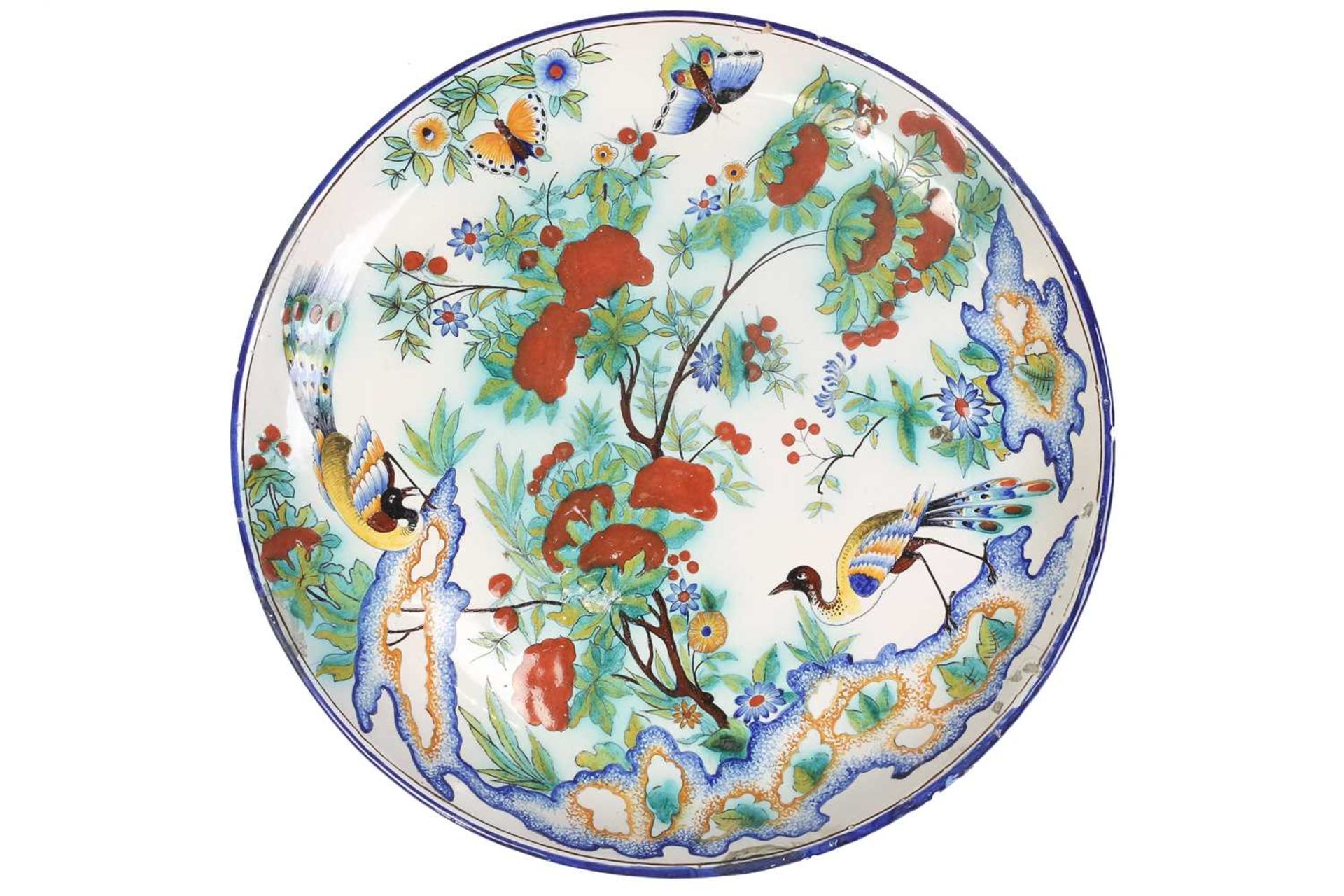 A Cantagalli Pottery charger, depicting exotic birds and butterflies among a flowering tree, painted