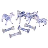 A group of four Dutch delft animals, Late 18th/ early 19th century, modelled as three cows and a