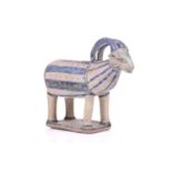 An Islamic pottery ram, probably Iran, the cylindrical body decorated with bands of black and