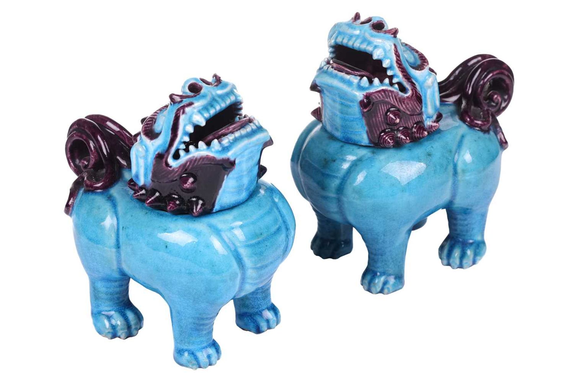 A pair of Chinese standing lion dogs, with removable heads and open mouths, in turquoise and