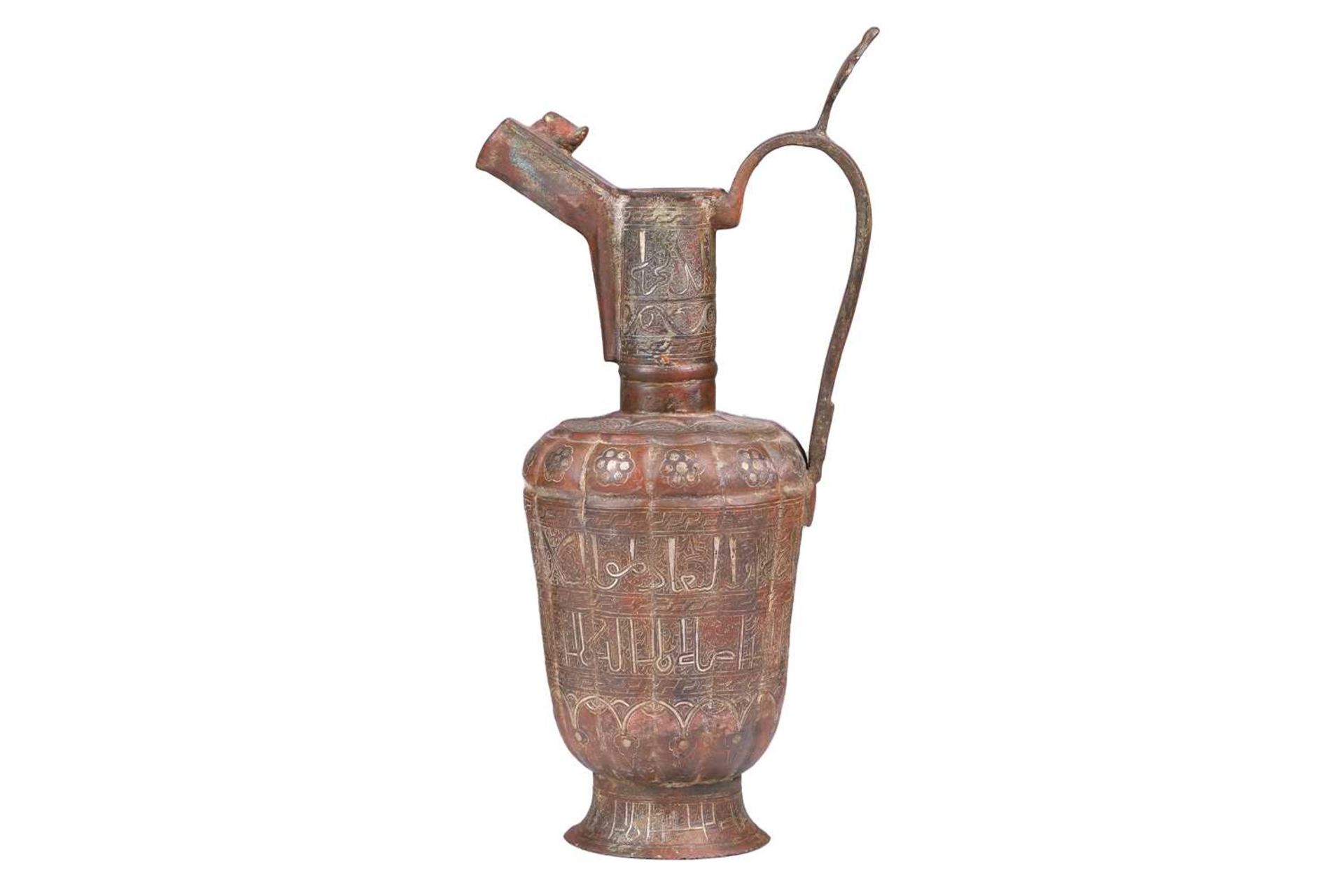 A 'Khorosan' style ewer, probaly North east Iran, of fluted lobed form, with stylised Islamic - Bild 3 aus 11