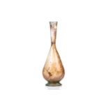 A Roman glass inverted baluster form flask with trail decorated neck, bearing an old handwritten