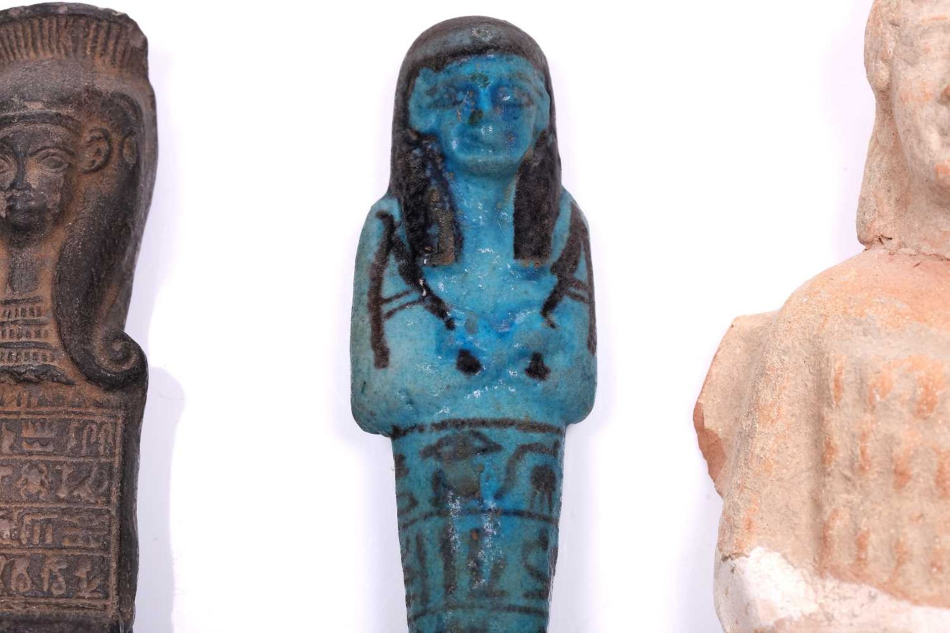 An Egyptian basalt-type Shabti with a hieroglyphic panel to the torso mounted in an old museum- - Image 4 of 9