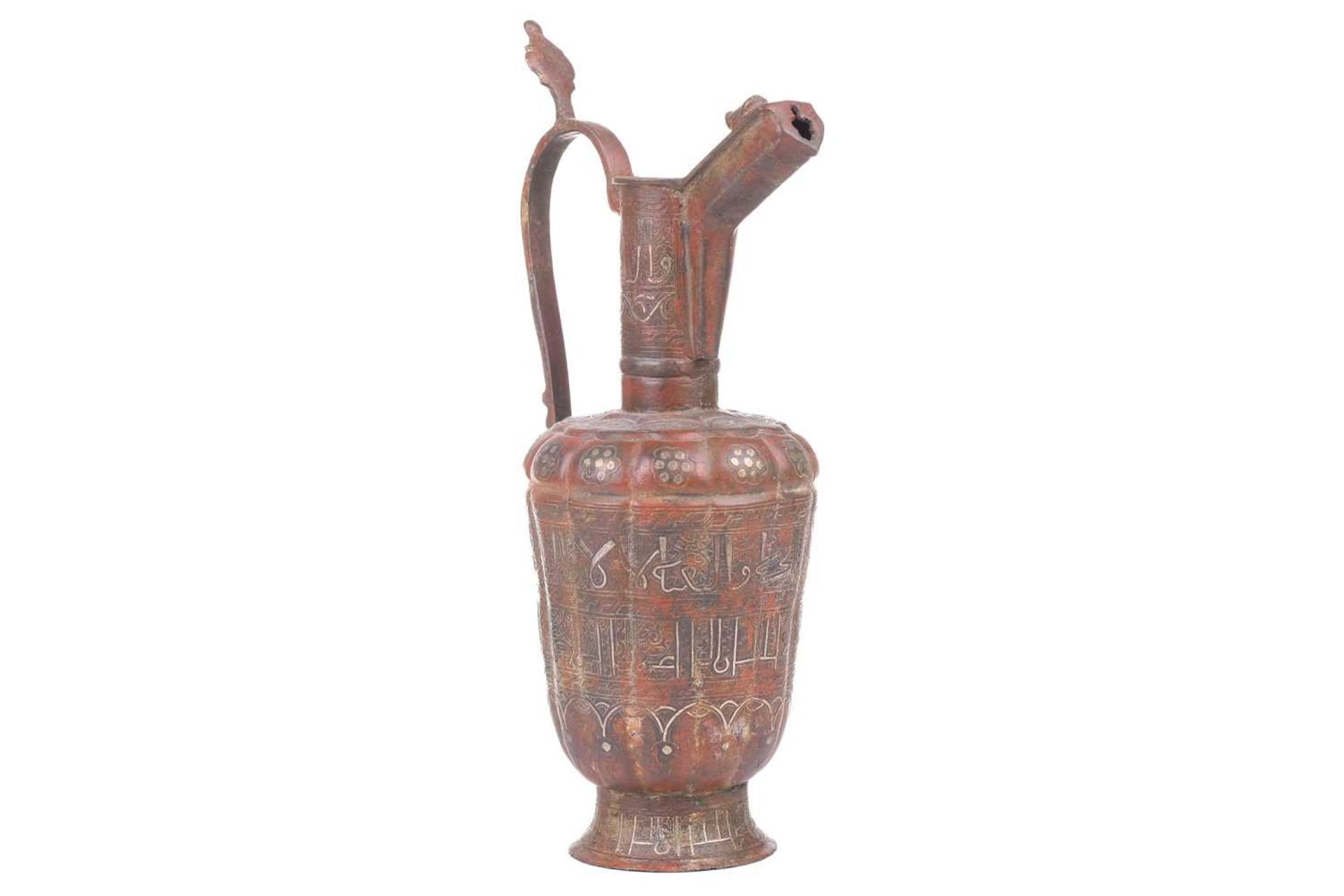 A 'Khorosan' style ewer, probaly North east Iran, of fluted lobed form, with stylised Islamic