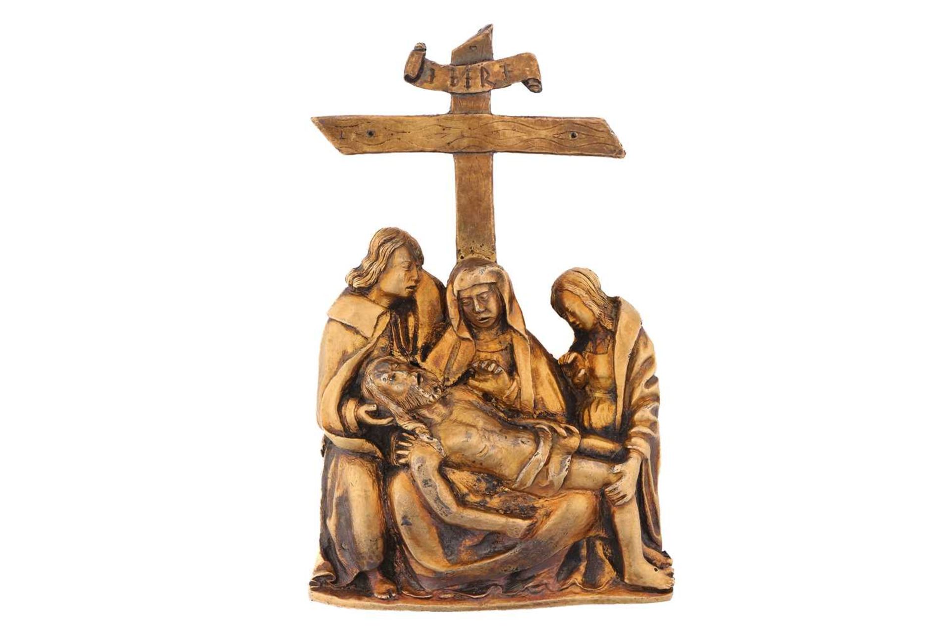 A German 15th century silver gilt mount, depicting The Lamentation Over the Dead Christ, the cross
