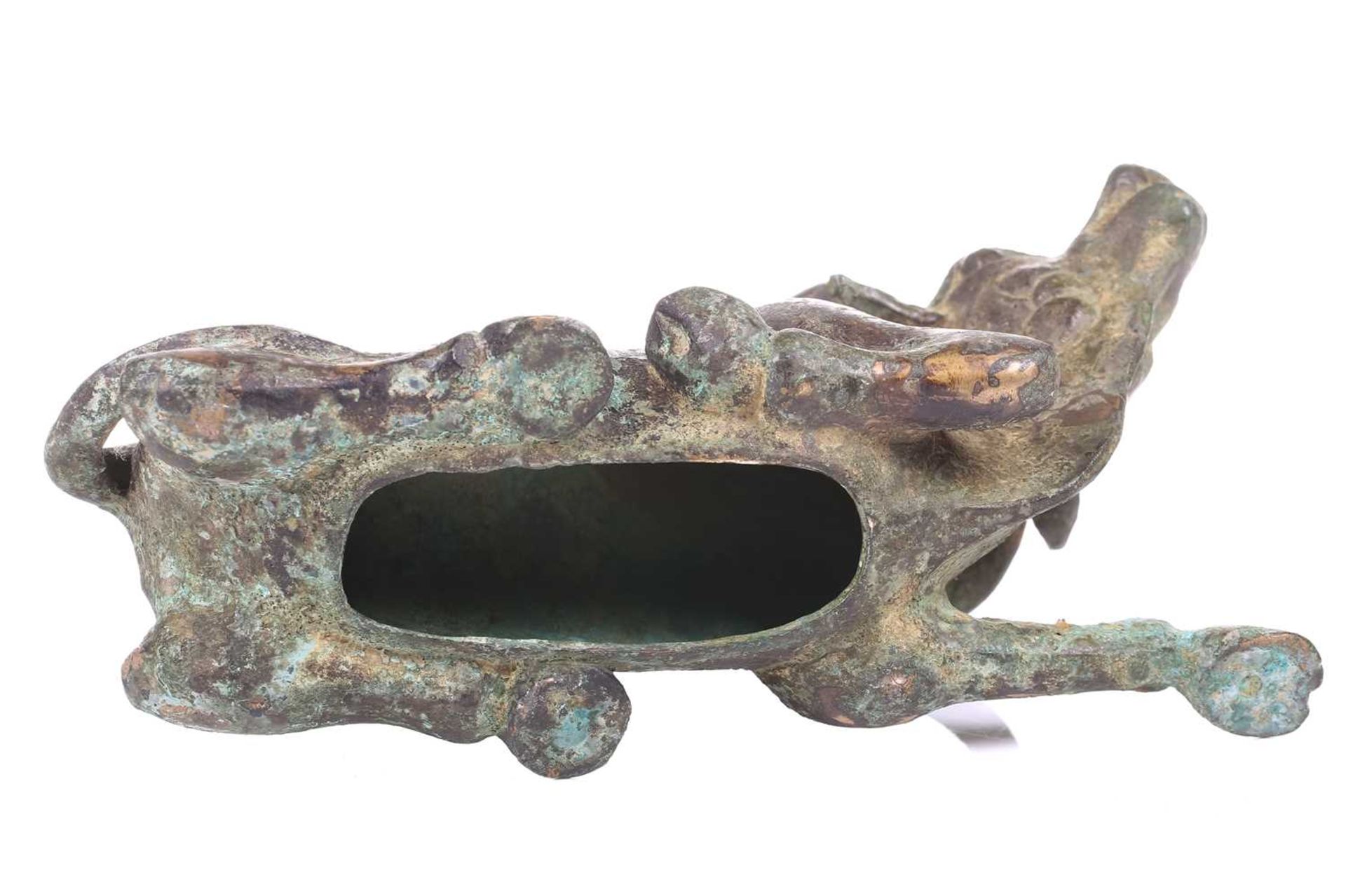 A Chinese bronze and gilt recumbent bull, possibly Zhou dynasty or later, the animal with one leg - Image 8 of 20