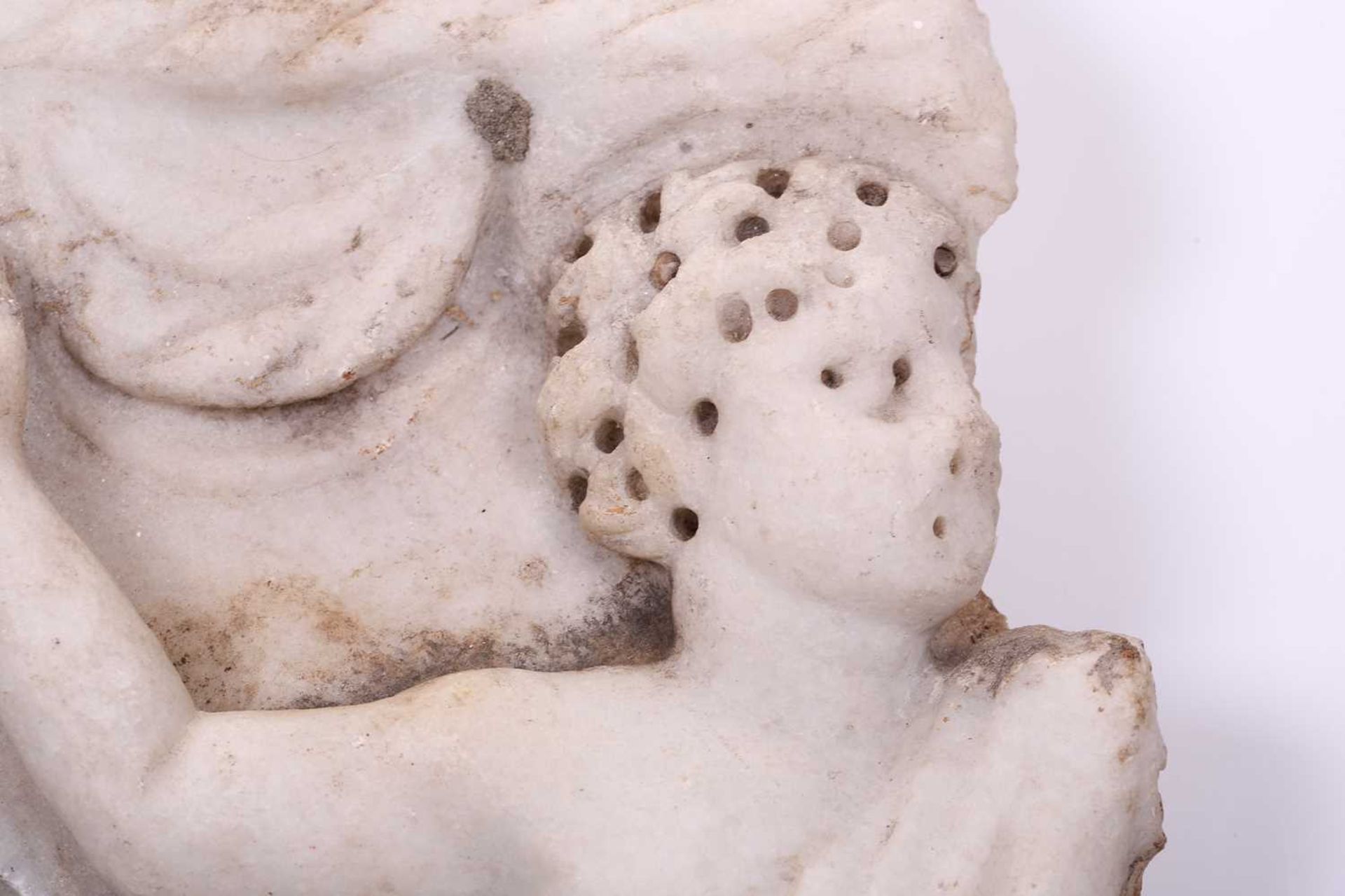 A Roman Marble fragment, 2nd/3rd century AD, possibly part of a sarcophagus, depicitng a youth in - Image 5 of 11