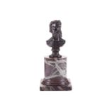 A bronze bust of Lord Frederick Leighton (1830-1896), on an associated red marble cylindrical