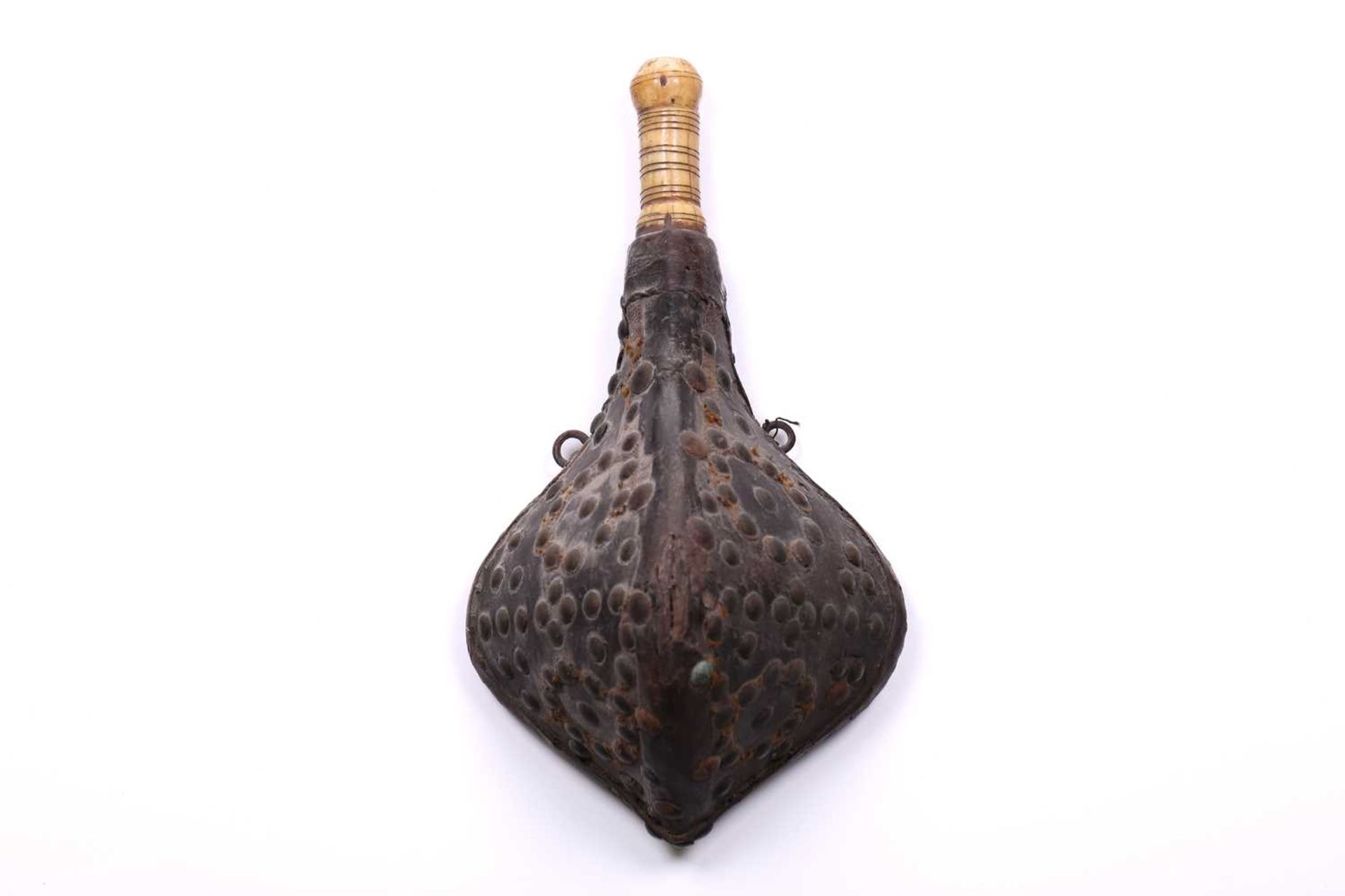 A North African triangular section powder flask 18th/19th century, with studded hide body and turned - Image 4 of 9