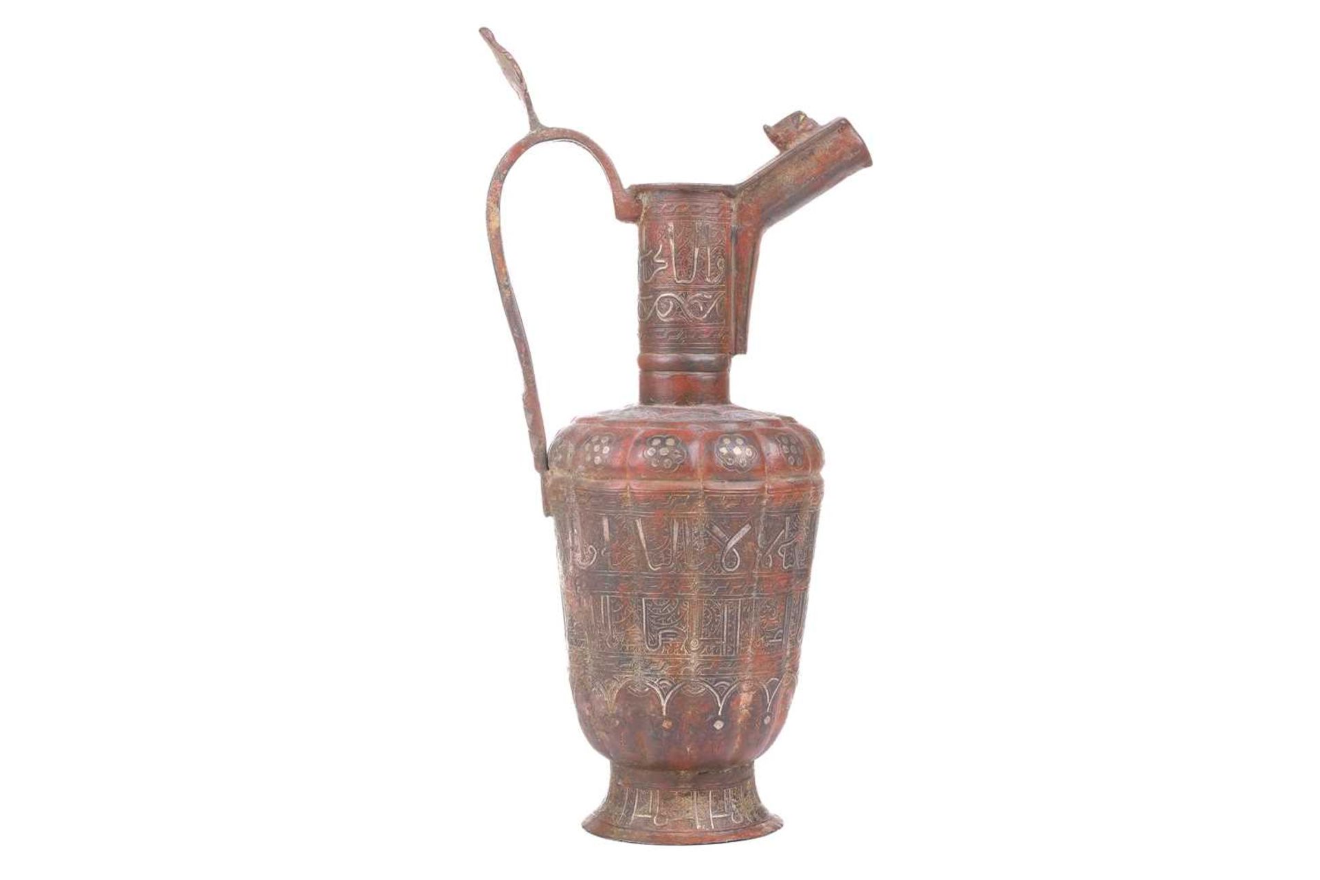 A 'Khorosan' style ewer, probaly North east Iran, of fluted lobed form, with stylised Islamic - Bild 4 aus 11