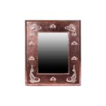 A Newlyn style Arts & Crafts rectangular copper wall mirror embossed with stylized fish and hearts