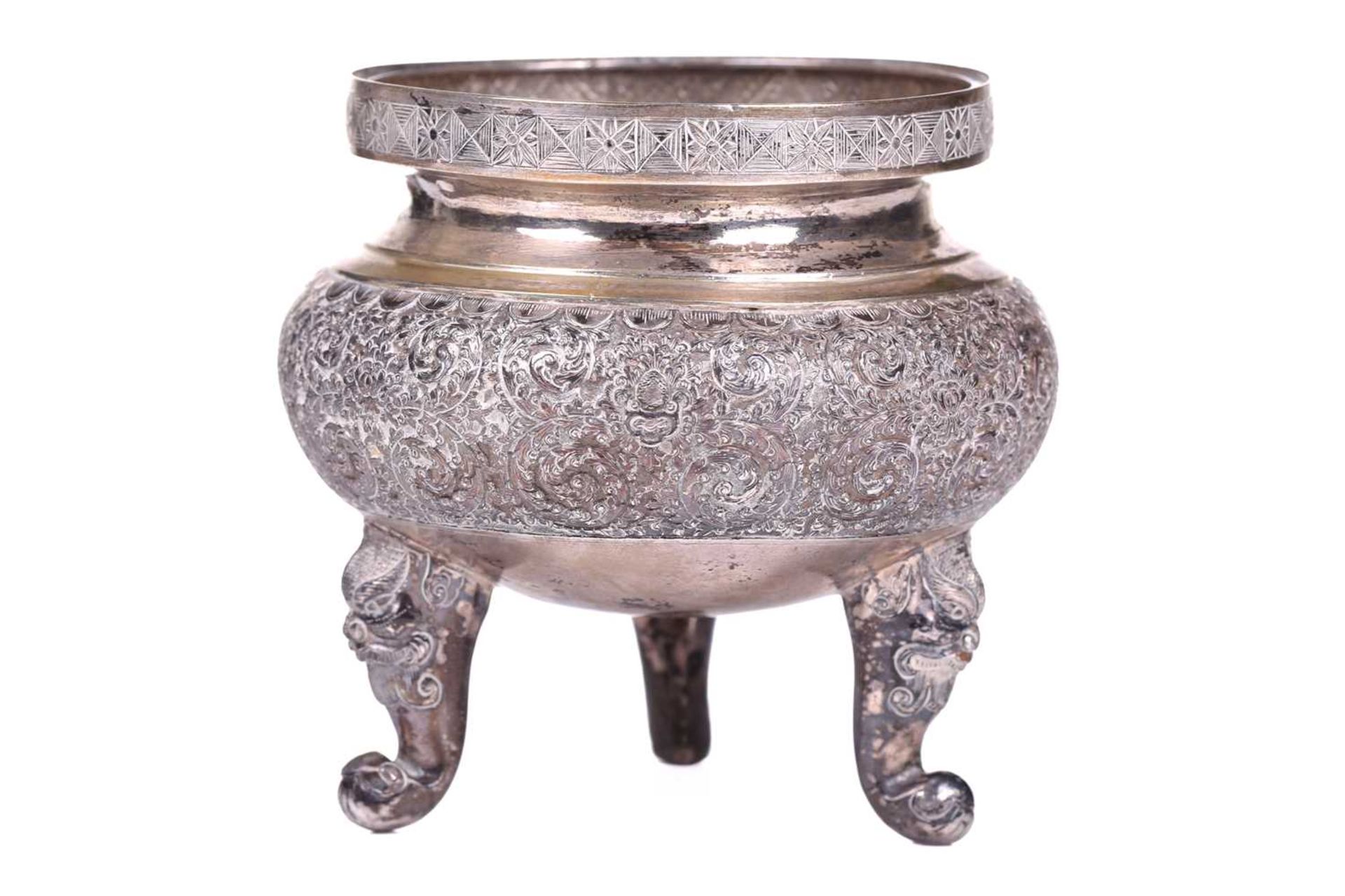 A Chinese silver censer of circular squat-bellied form, late Qing Dynasty/early Republic, the body