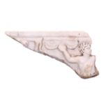 A Roman Marble fragment, 2nd/3rd century AD, possibly part of a sarcophagus, depicitng a youth in