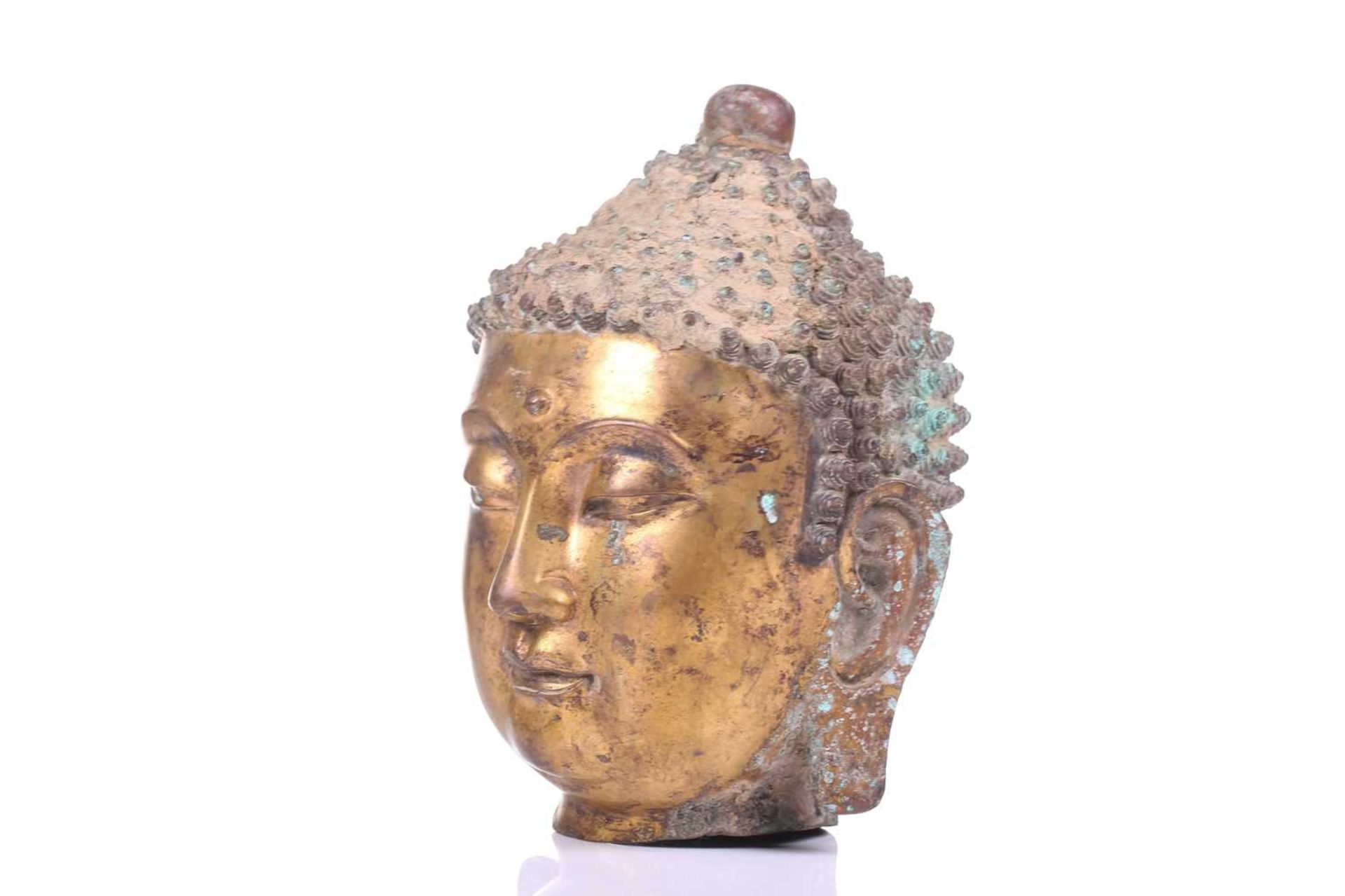 A Sino-Tibetan gilt bronze head of a Buddha, with elongated earlobes, tightly curled hair with domed - Image 3 of 9