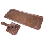 A Newlyn School rectangular dressing table copper tray embossed with floral buds and a central