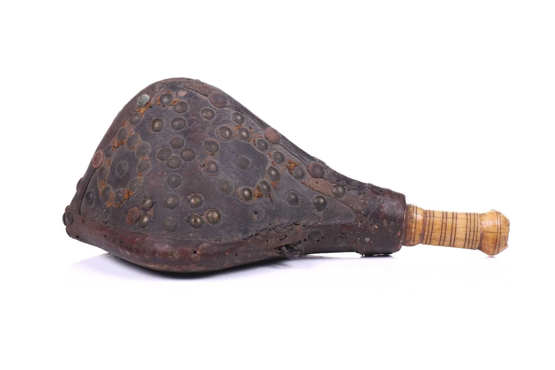 A North African triangular section powder flask 18th/19th century, with studded hide body and turned - Image 2 of 9