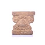 An Abbasid-style carved terracotta capitol with scroll decoration. 13 cm wide x 10 cm deep x 13 cm