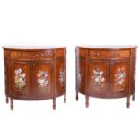 A pair of Edwardian painted mahogany demilune commodes, the crossbanded tops with painted patera