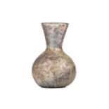 A roman glass small vase or vial, of baluster form, with iridescence to the surface, 11cm high