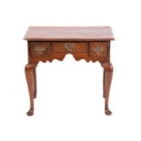 A George III and later oak kneehole lowboy with three short drawers and cabriole legs fore and