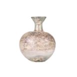 A Roman glass vase, of bulbous form with a squat neck and flared rim, with oxidisation to the