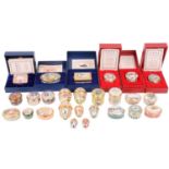 A collection of Halcyon Days enamel boxes, including Christmas boxes for 1989, 1990, 1993, 1994,